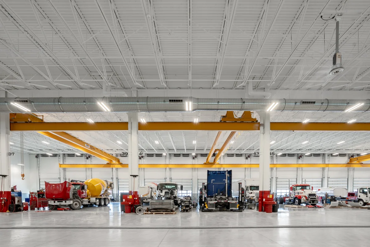 Heavy-duty service bays with multiple overhead bridge cranes.
