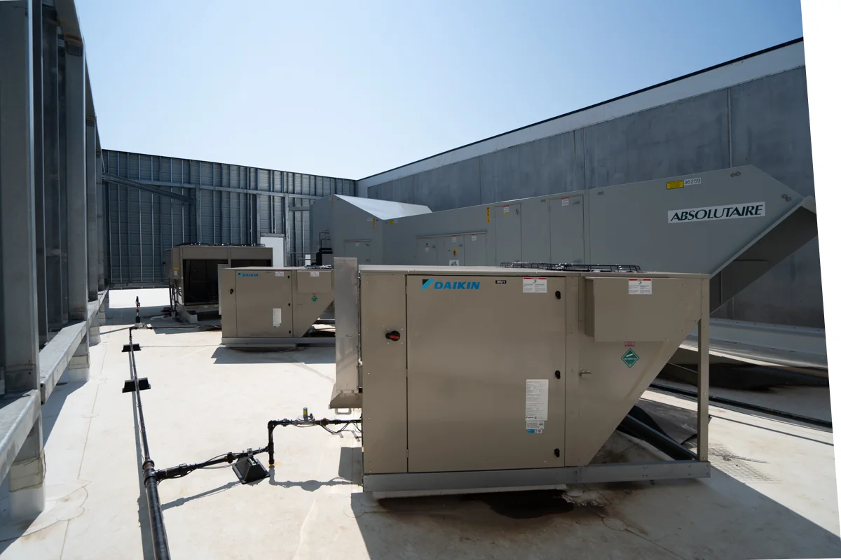 Rooftop HVAC and makeup-air equipment serving Housby Mack.