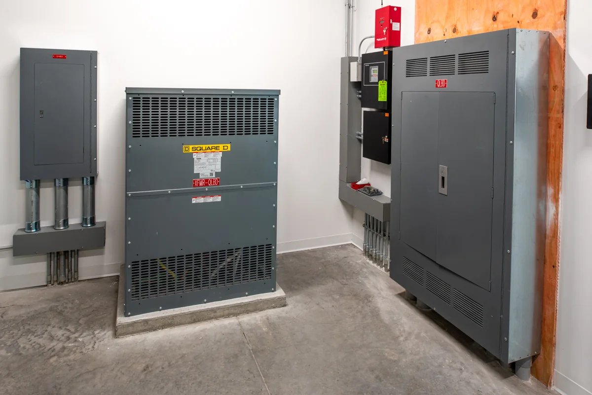 Electrical transformer, distribution panels, and fire-alarm equipment.